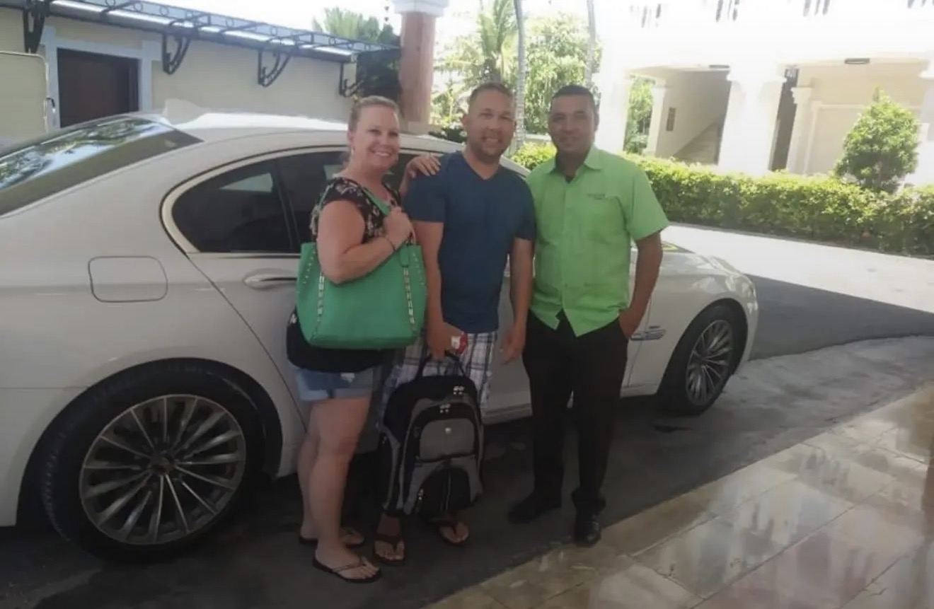 Guest with First Class Transfer Punta Cana drivers at vehicle